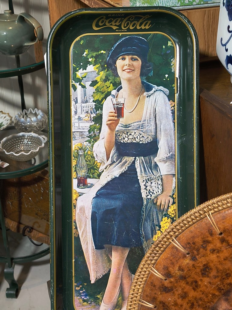 Vintage Coca Cola sign with lady, at Yesterday's Treasures, Willis, TX.
acrossthelake.blog