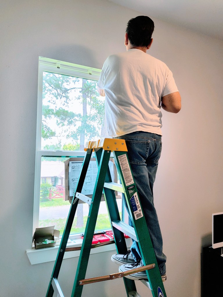 Willie installing blinds in the office at Royalview.
acrossthelake.blog