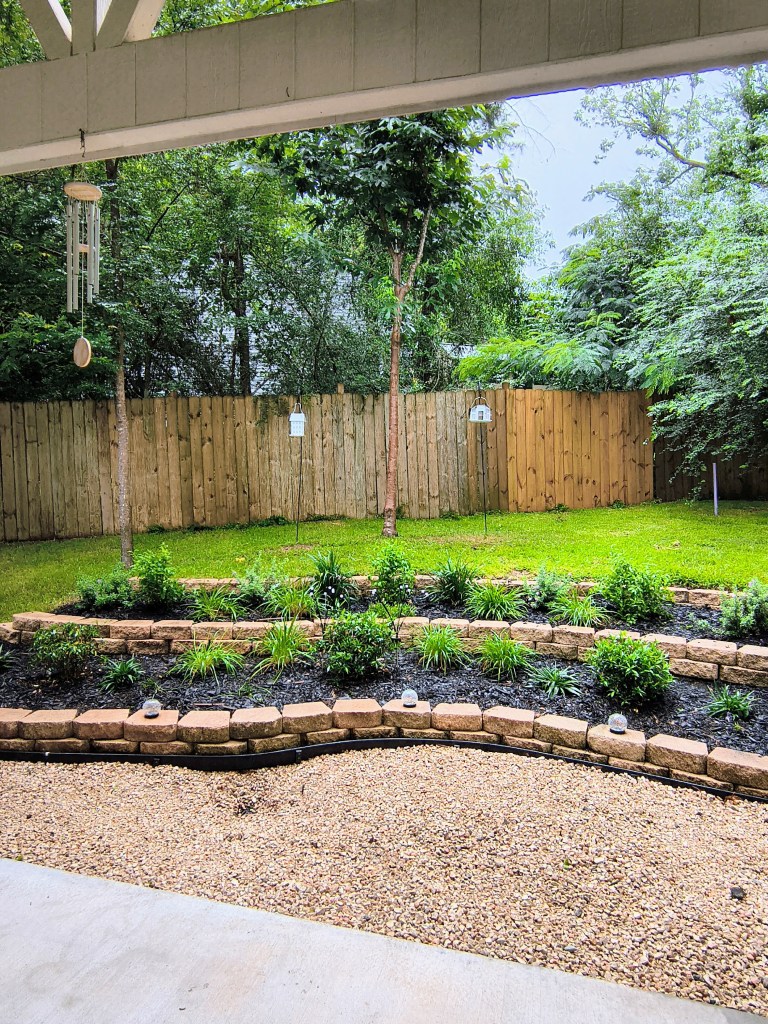 Royalview's backyard tiered garden.
acrossthelake.blog