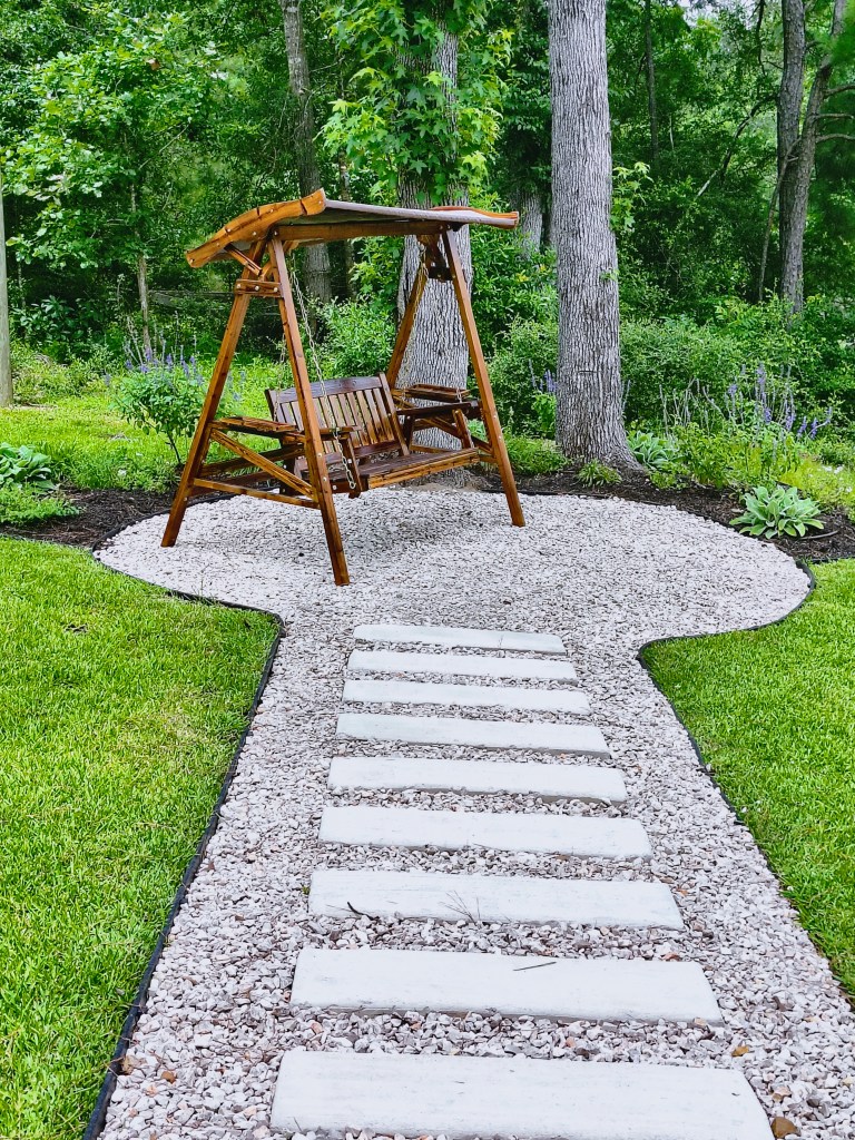 Royalview's front North garden with swing.
acrossthelake.blog