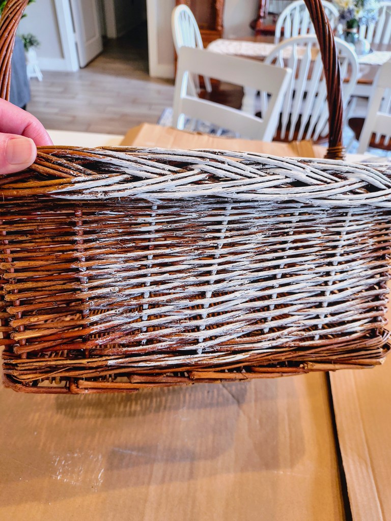 Wicker basket being painted white.
acrossthelake.blog