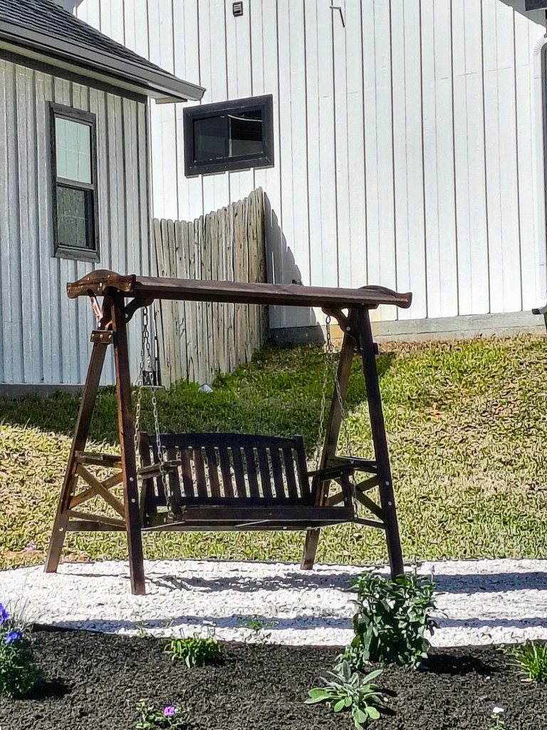 Wooden Outdoor Swing with Stand and Canopy, from Amazon.
https://amzn.to/3QLKOpW  Paid Link
