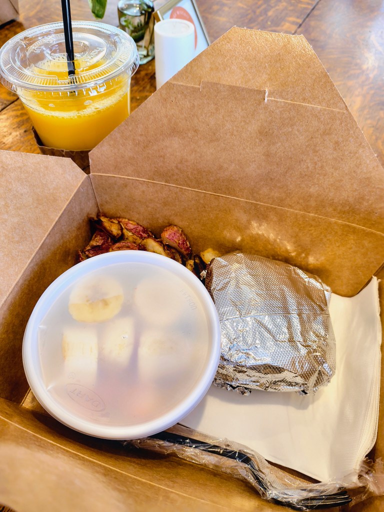 Spinach, Egg, and Feta Biscuit Panini in a Brunch Box from Honey's Coffee and Biscuits in New Waverly, TX.  acrossthelake.blog