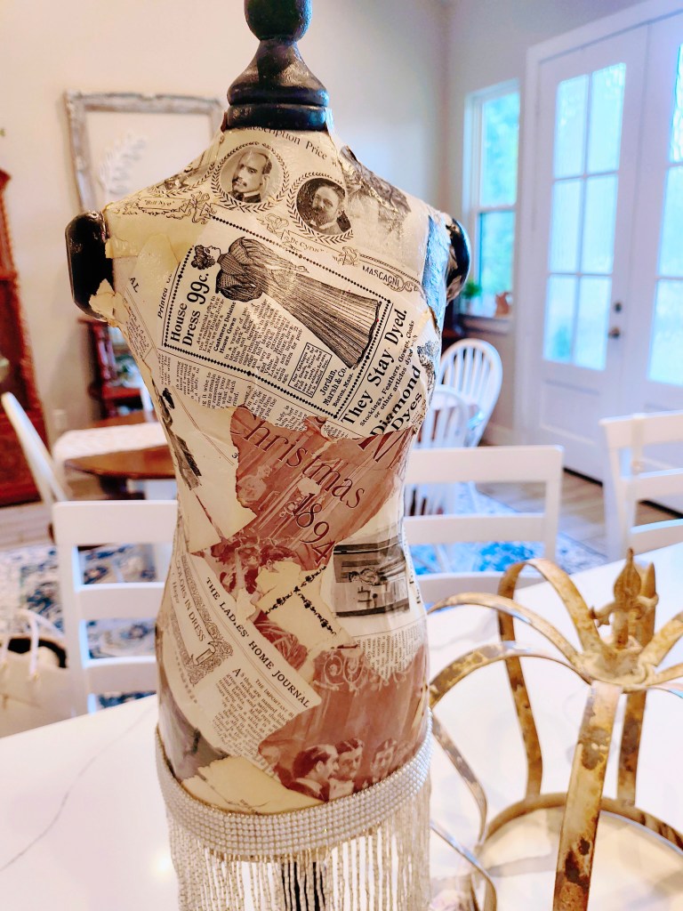 Vintage style mannequin/dress form covered in vintage Ladies Home Journal pages.  From Sweet Magnolia Emporium in Rosey Opals Collective Market, in New Waverly, TX.
https://www.instagram.com/sweetmagnoliaemporium/
acrossthelake.blog