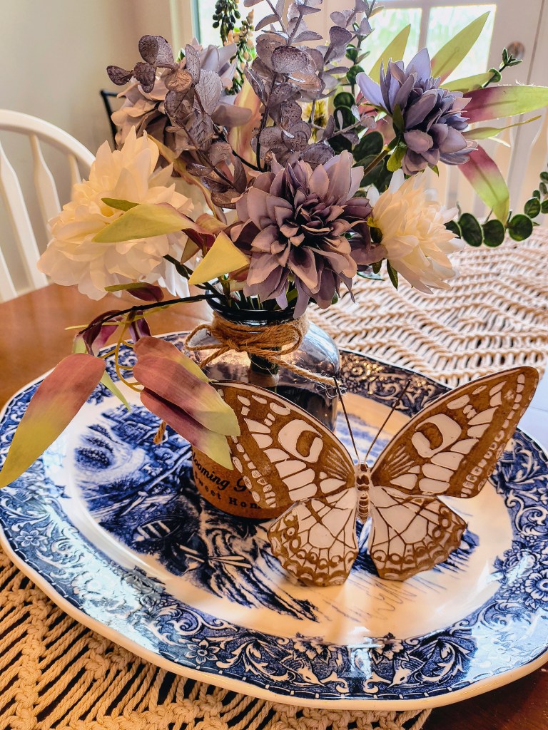 Leftover Brand Faux Floral Arrangement and Vase Blue Country  Farmhouse Style from Amazon.
https://amzn.to/4i5KePk

