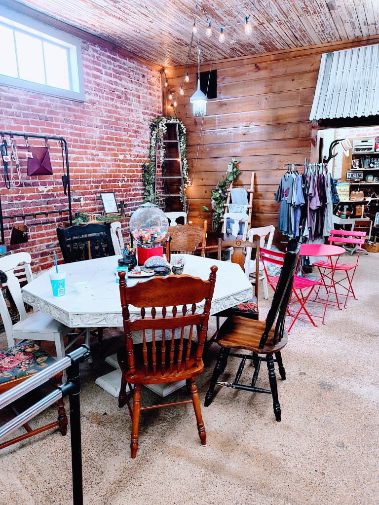 Ice cream parlor seating inside Rosey Opals Collective Market in New Waverly, Texas.
acrossthelake.blog