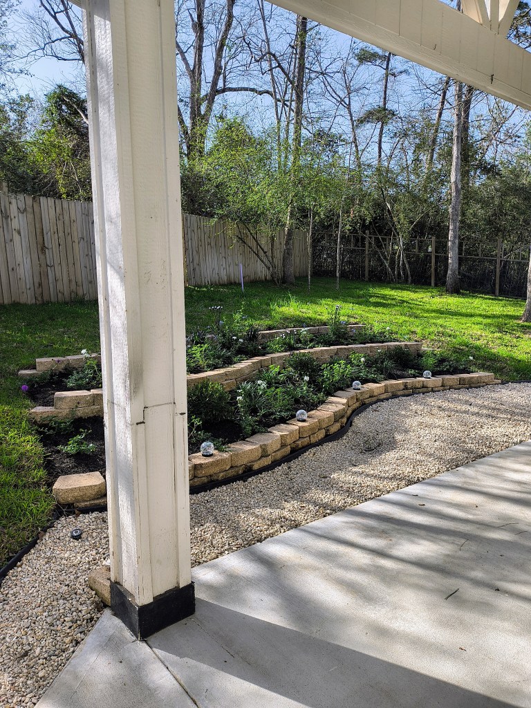 3 tiered backyard garden on a hillside.  acrossthelake.blog