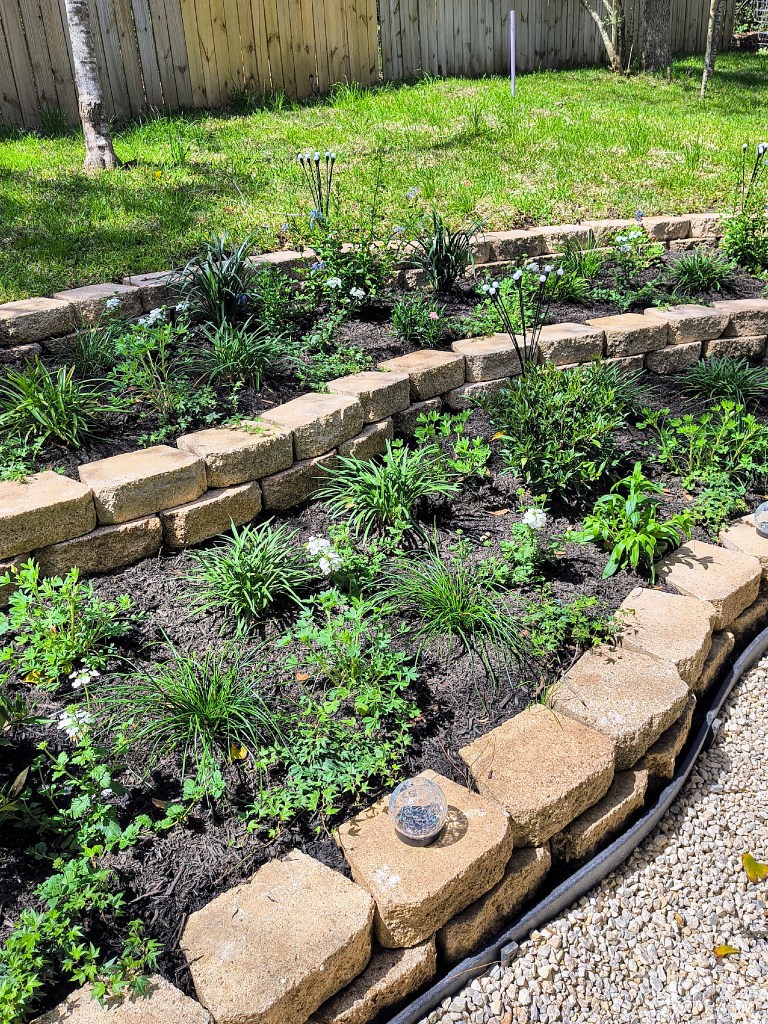 Royalview's backyard 3 tiered garden.  acrossthelake.blog