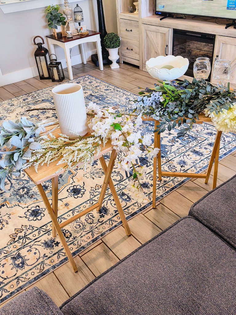 Making faux floral arrangements in white milk glass stemmed bowl and clear glass apothecary style jars.
acrossthelake.blog