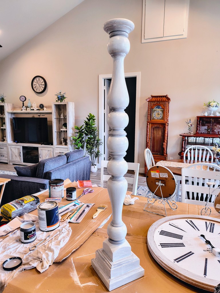 After picture, completed paint redo makeover project for tall wooden candlestick holder.
acrossthelake.blog