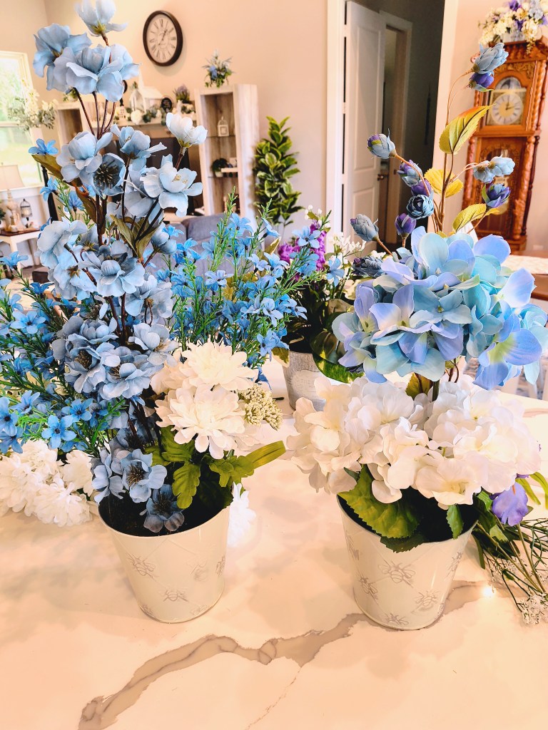 Making faux floral arrangements in blue.
acrossthelake.blog